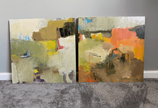 Unfinished landscape paintings displayed in a softly lit bedroom as part of the artist’s reflection process.